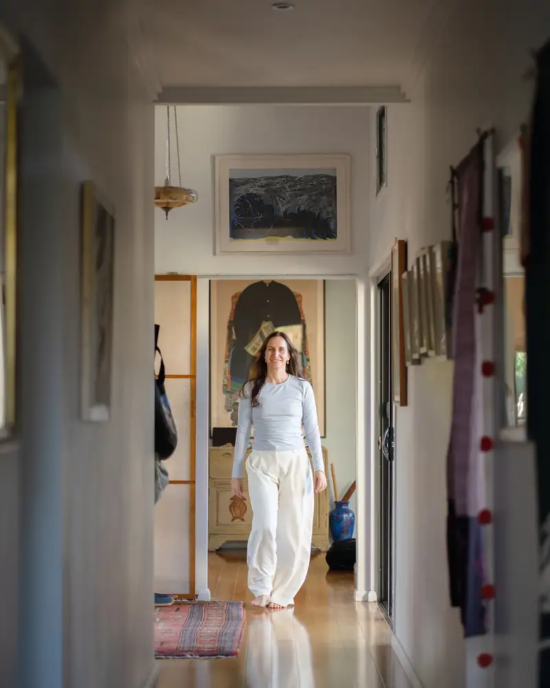 A Grove Support Services support worker walking through a light-filled location space